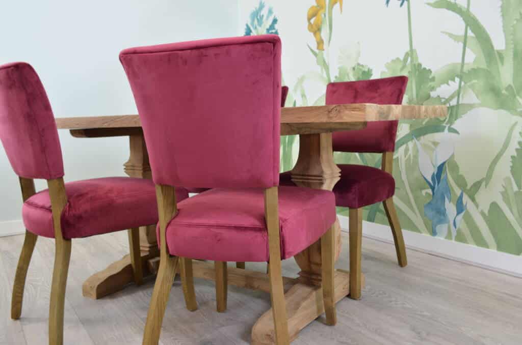 Red velvet dining chairs with oak legs