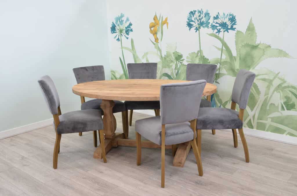 Grey Velvet Lucca Chairs around a reclaimed Teak Table